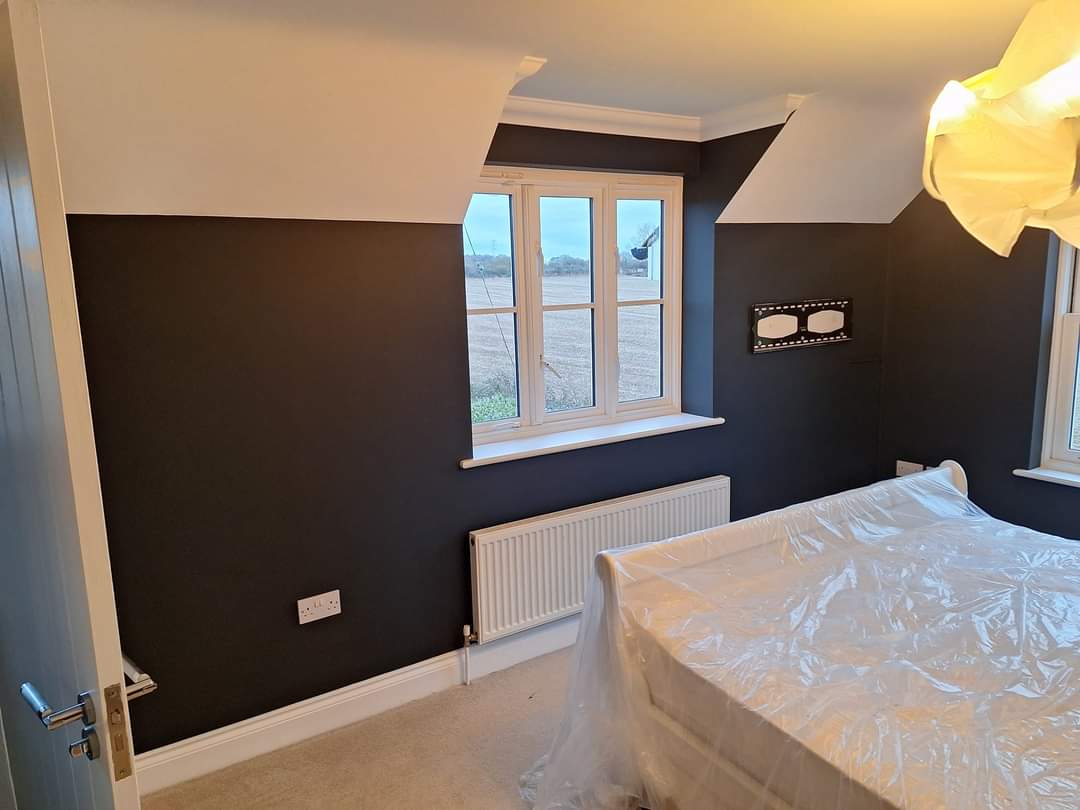 Bedroom decorated with a feature wall.